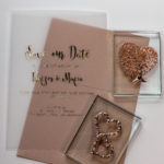 Pink gold wedding invitation with hearts