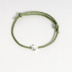 witness bracelet with green cord